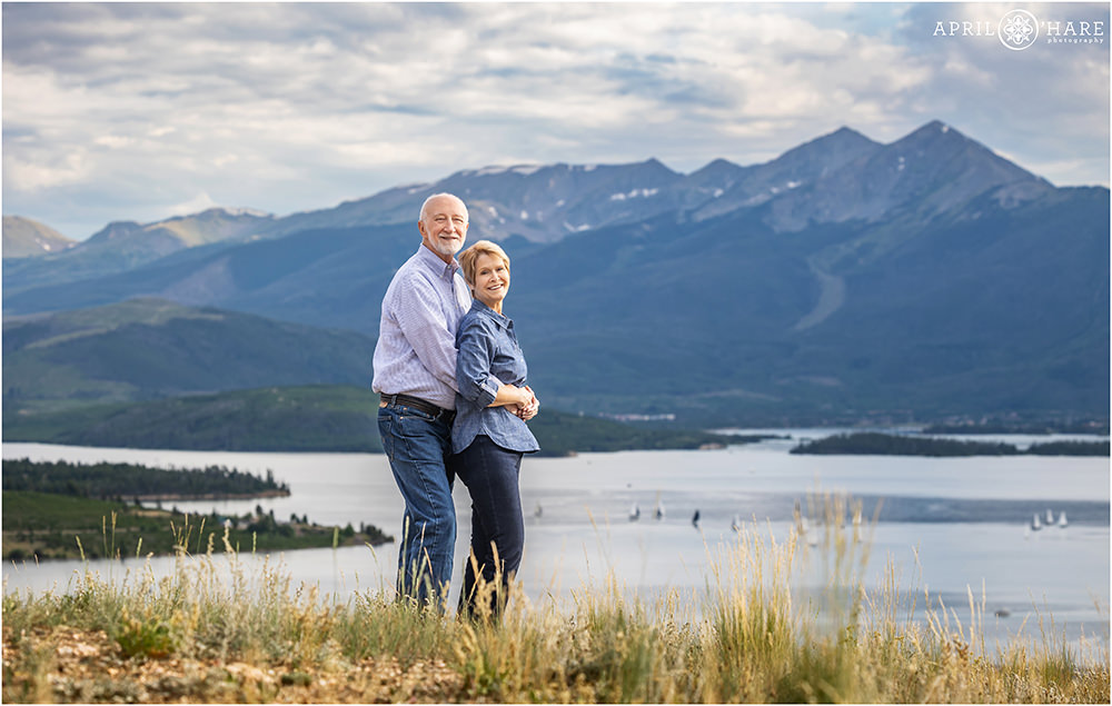 Couples photo with a pretty mountain backdrop in front of Lake Dillon at Tenderfoot Mountain Trailhead