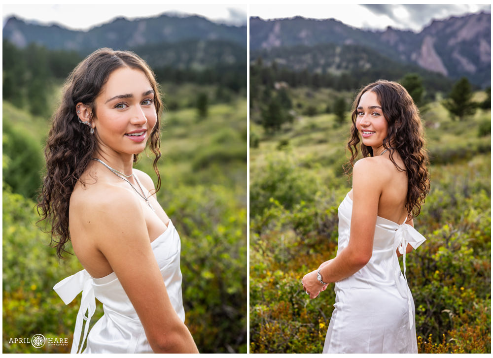 Senior photos for a girl wearing a satin white dress at South Mesa Trail in Boulder CO