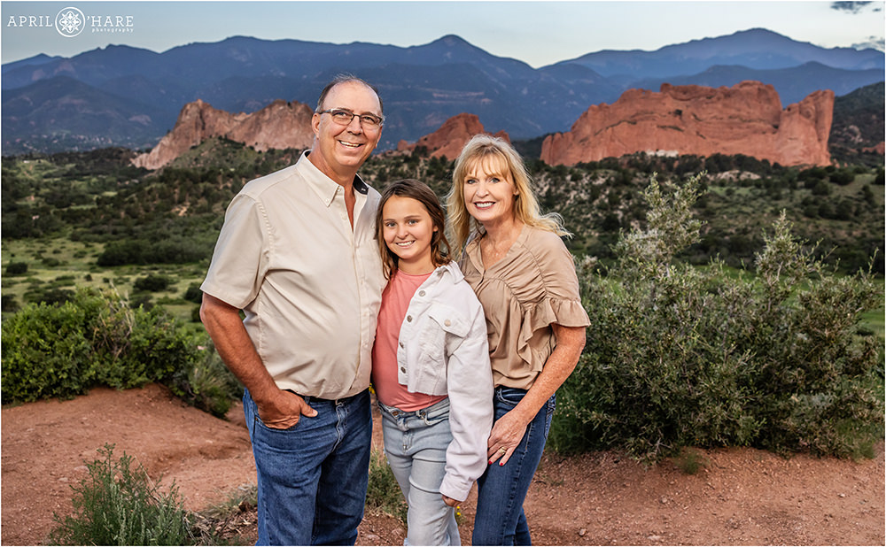 Family of three is photographed together during their summer vacation at the Mesa Overlook at Garden of the Gods in Colorado Springs
