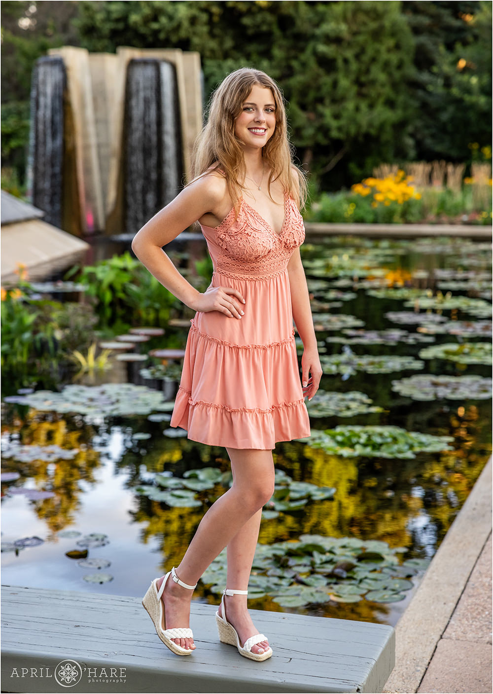 Waterlily garden backdrop with waterfall feature for a Denver Botanic Gardens Senior photoshoot