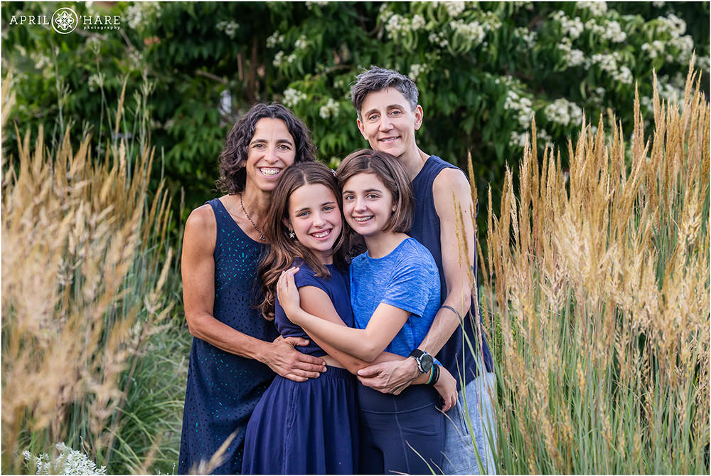 Cute family of four with two daughters at Denver Botanic Gardens in Colorado