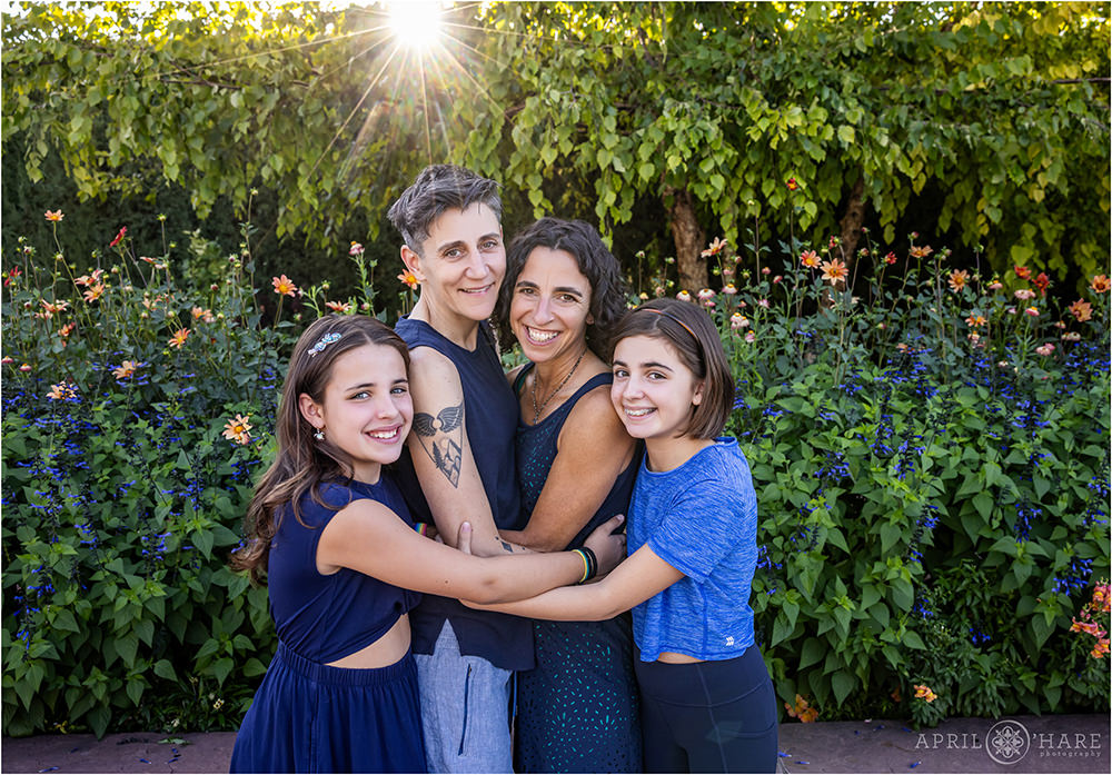 Beautiful backlit family photos with blue and orange flowers at Denver Botanic Gardens in Colorado