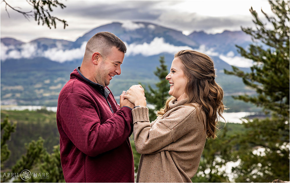 Cute photo of a couple in front of a mountain backdrop at Sapphire Point in Colorado