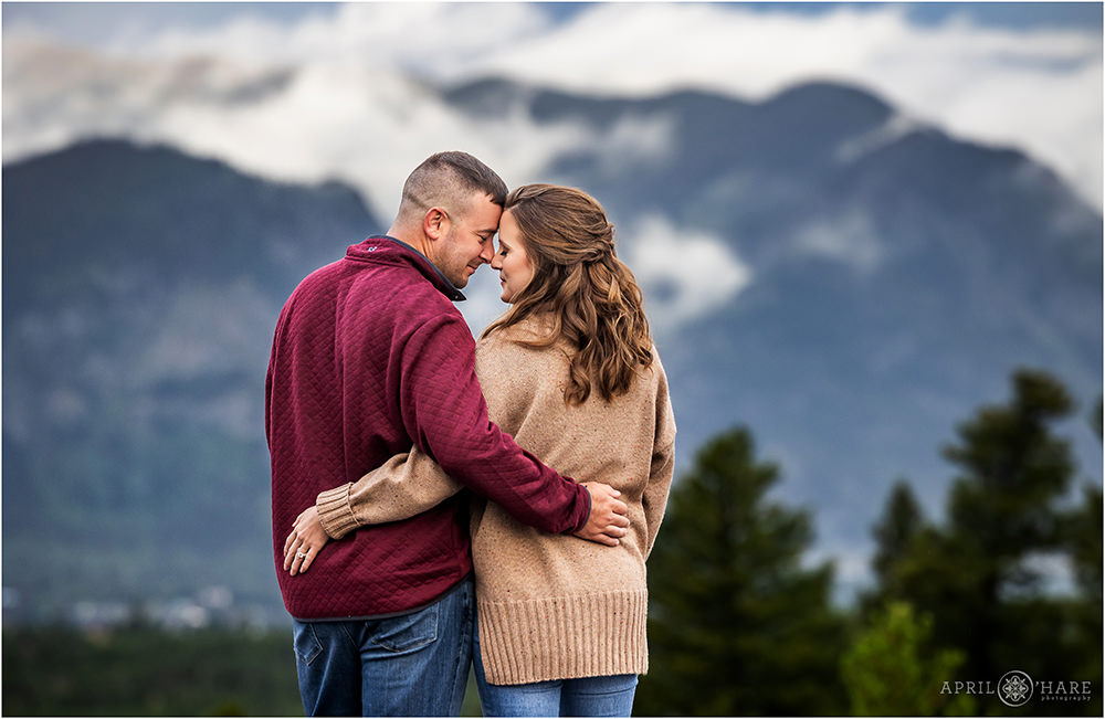 Romantic engagement photography with a pretty misty mountain backdrop at Sapphire Point