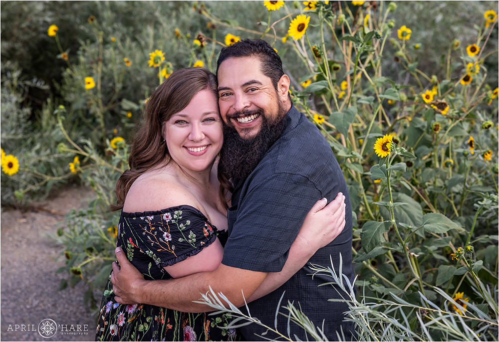 Couple portrait at James Bible Park with wild sunflower backdrop in Denver Colorado