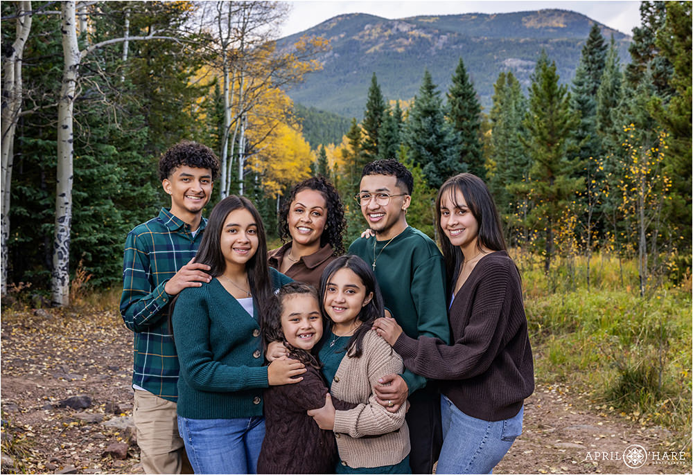 Beautiful Family with 6 kids in the woods of Evergreen Colorado during autumn