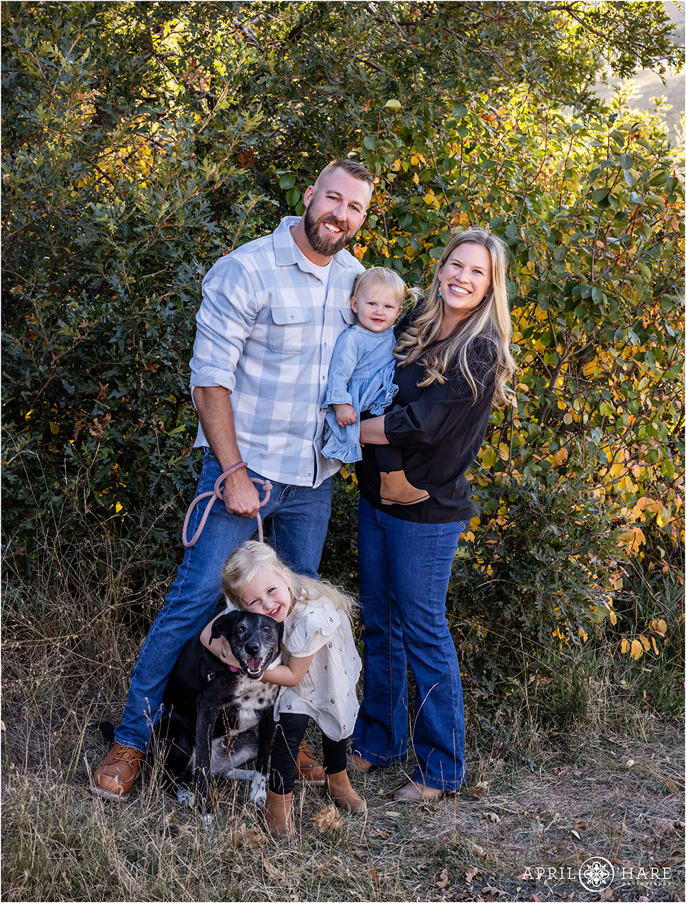 Adorable family with two little girls and a sweet dog at South Valley Park in Littleton Colorado