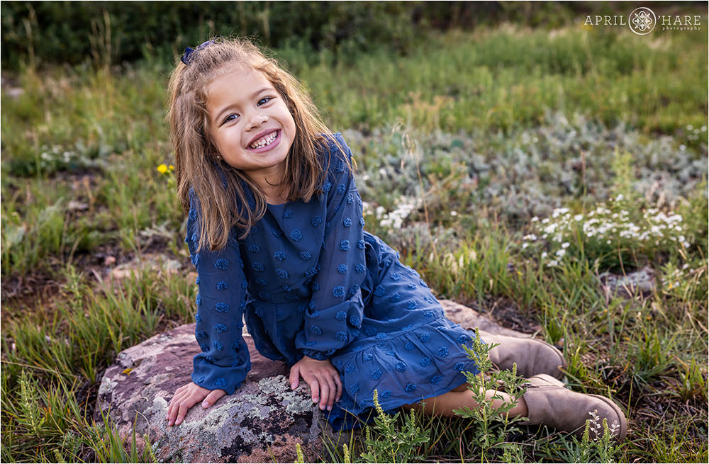 Cute girl wearing a blue dress at Shanahan Ridge Trailhead in Boulder CO