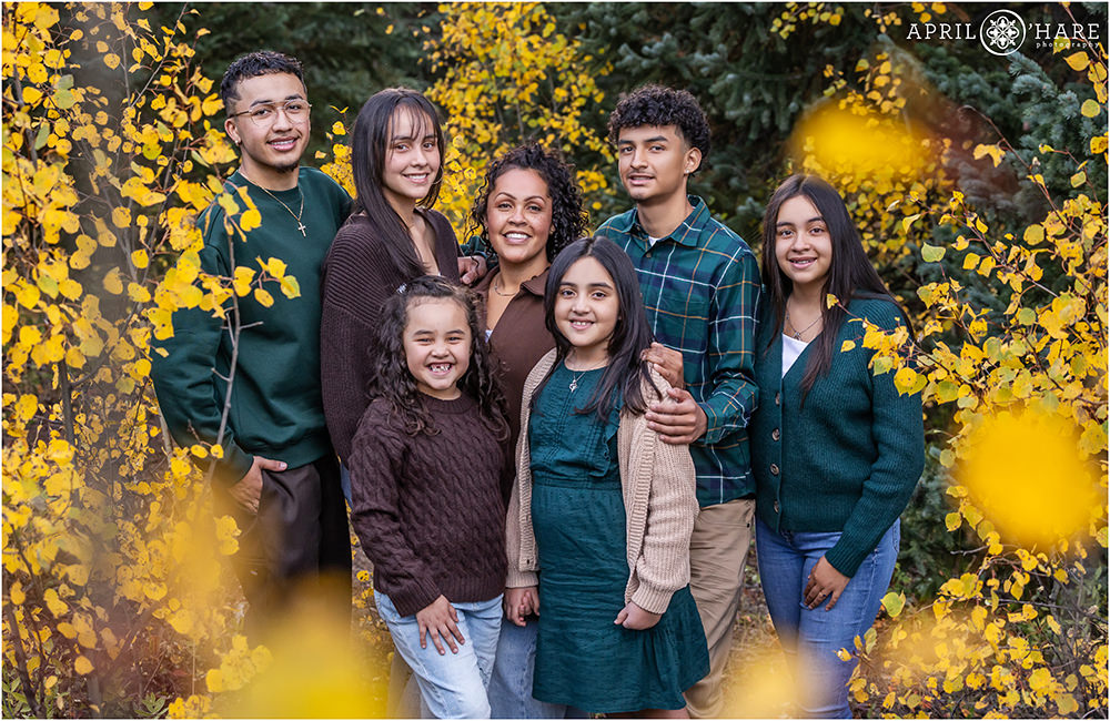 Gorgeous fall color family photo of a mom with her six children in Evergreen Colorado