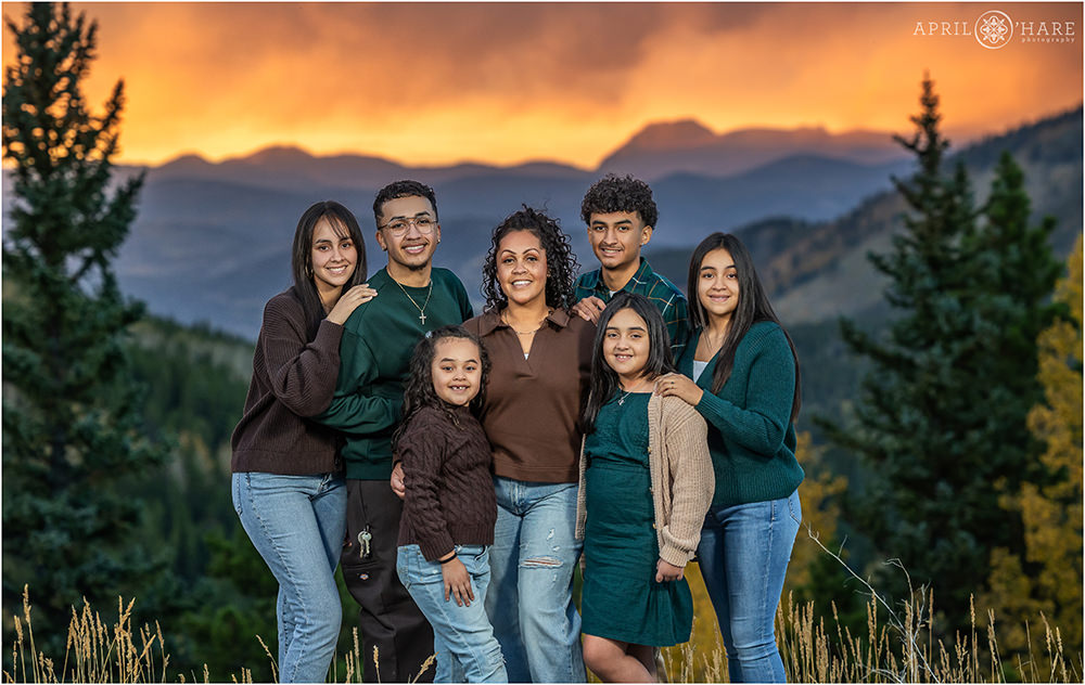 Beautiful sunset photo with a mountain fall color backdrop on Squaw Pass Road for a mom with her 6 kids in Evergreen CO