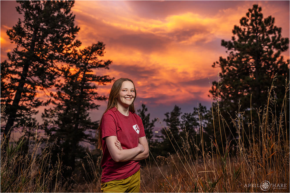 Stunning orange, pink, and purple sunset sky backdrop on Lookout Mountain at a high school senior yearbook photography session