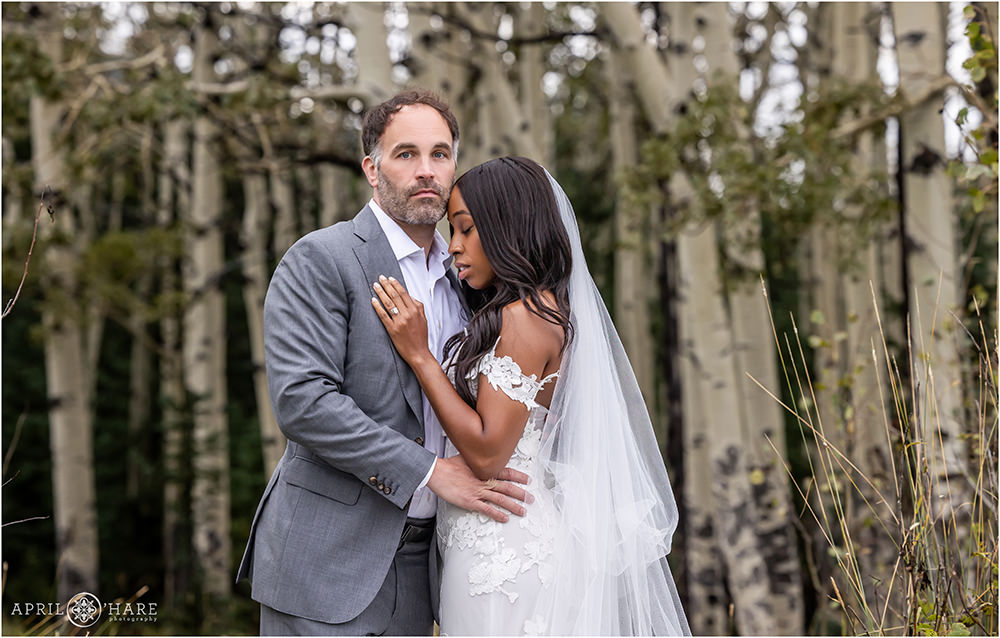 Romantic wedding photo on an aspen tree grove in Evergreen Colorado
