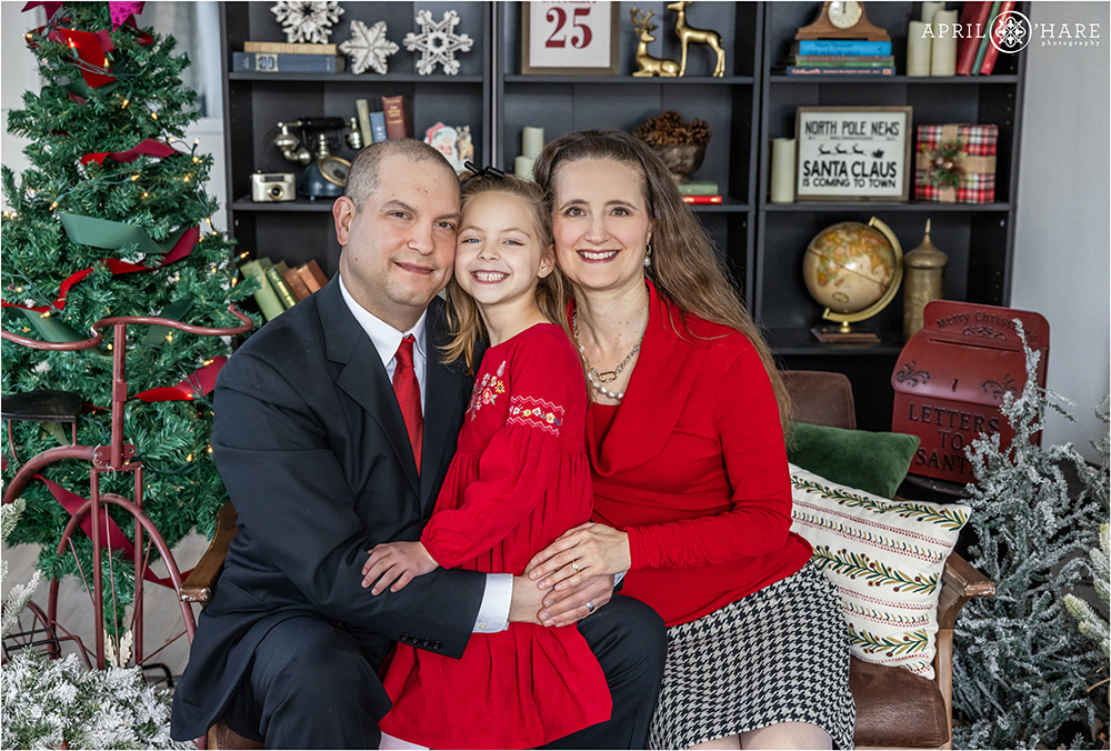 Family portraits in the Christmas library set in Denver CO
