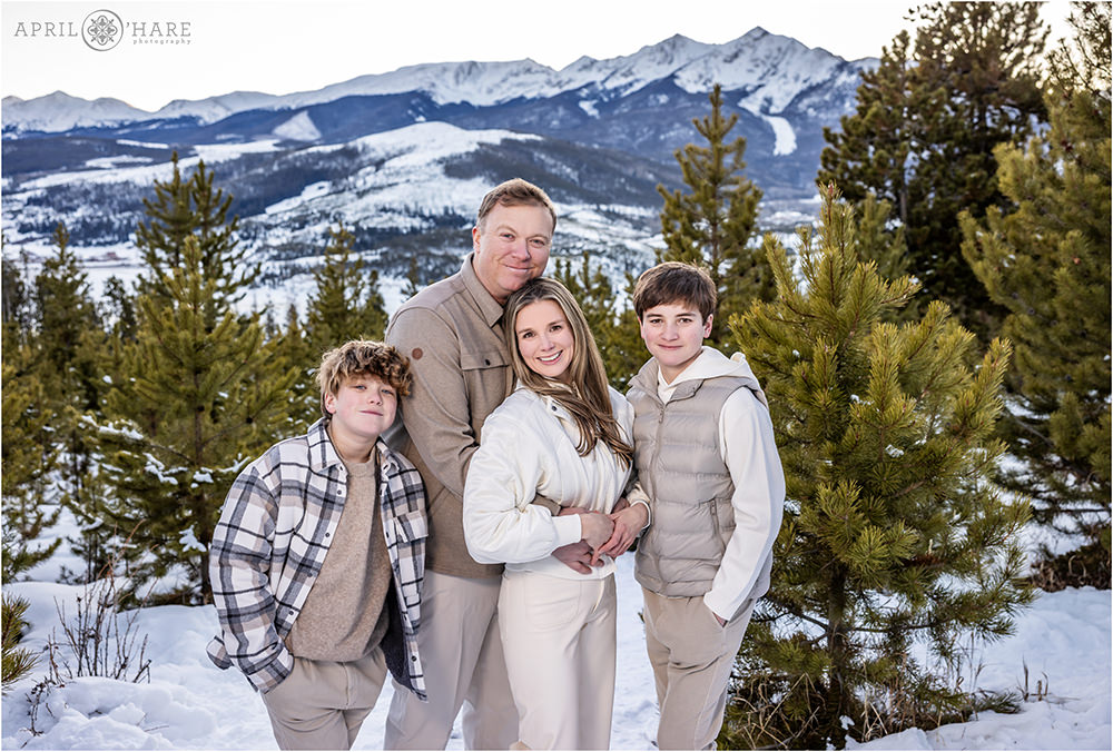Gorgeous family portrait with a pretty snowy mountain backdrop near Breckenridge in Colorado
