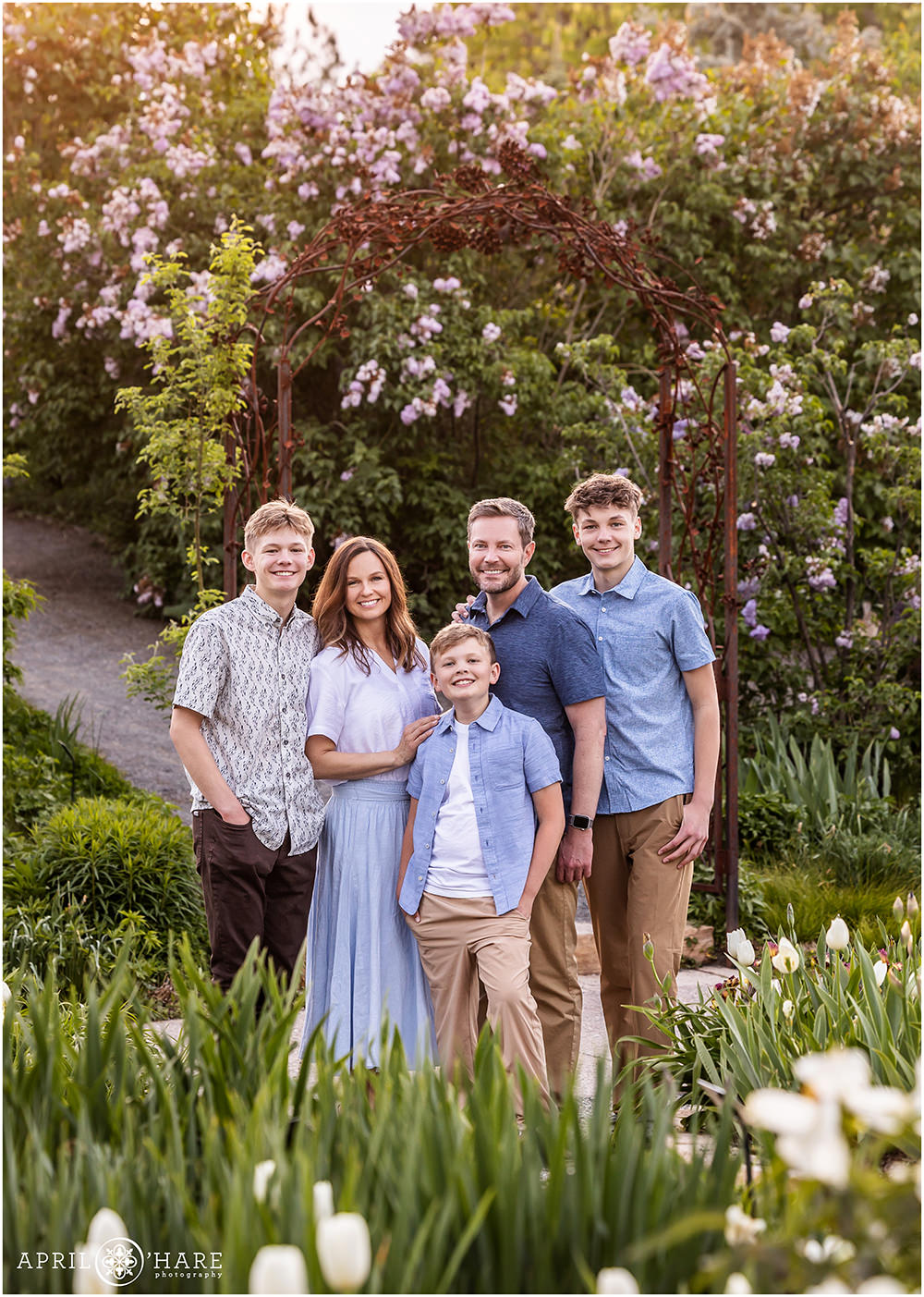 Beautiful family with teen boys photographed in the spring flowers at Denver Botanic Gardens