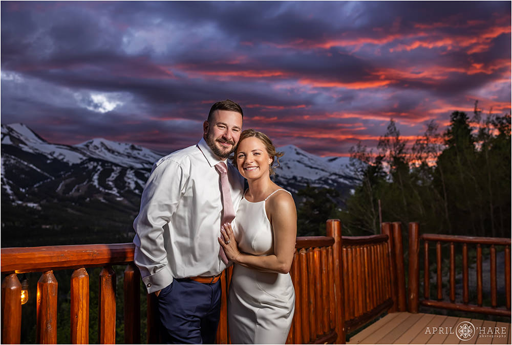 Bride and Groom with pretty sunset sky with mountain backdrop at Lodge at Breckenridge in Colorado
