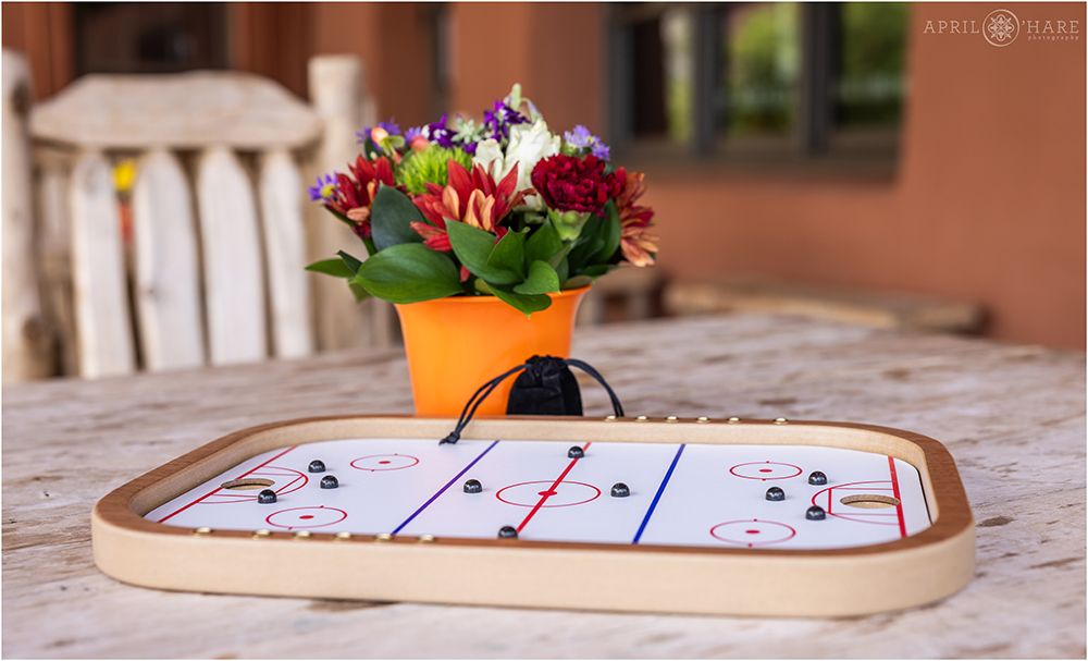 Board games set up on the balcony at Red Rocks Trading Post Backyard wedding reception for a casual brunch party
