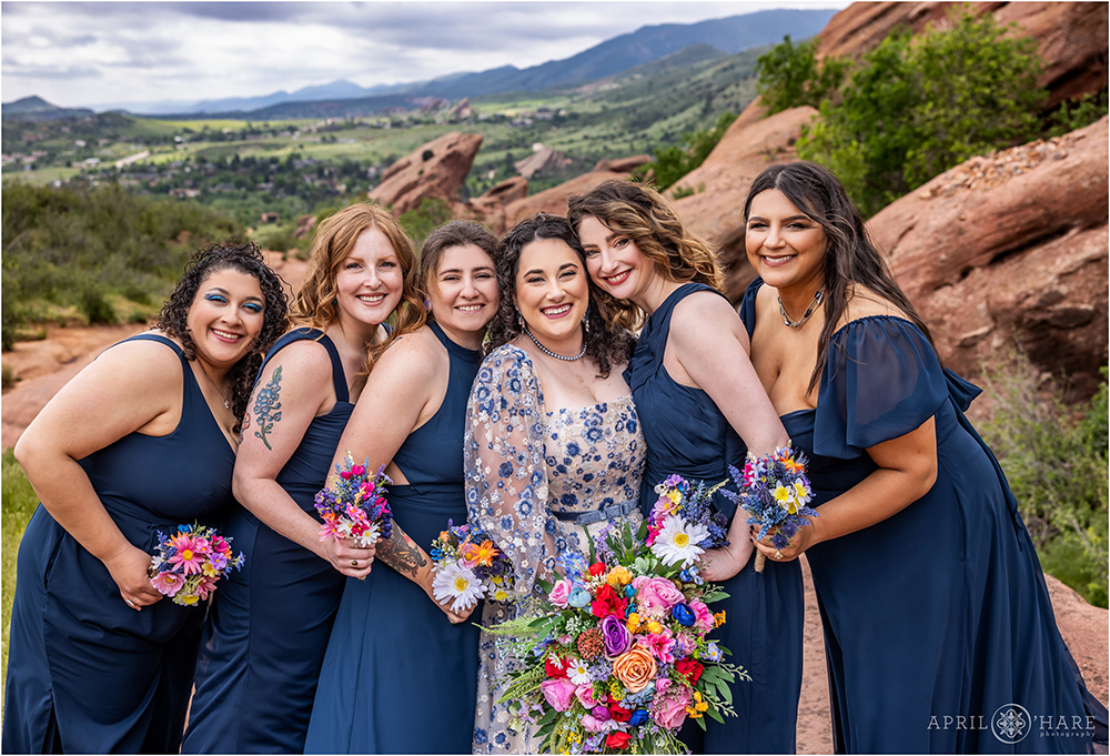 Bride with her bridesmaids on the Trading Post Trail at Red Rocks in Colorado