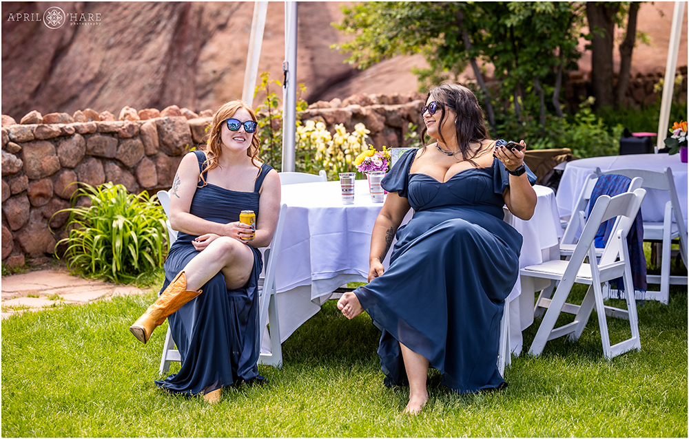 Bridesmaids relax and chat with each other at a relaxed casual brunch wedding at Red Rocks