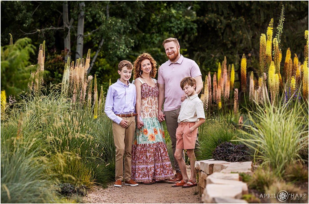 Gorgeous family photo for a family with two boys standing with unique plants at Denver Botanic Gardens