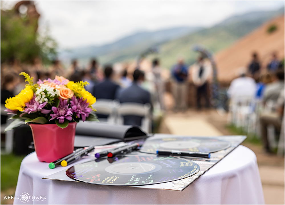 Guests Sign in on Records at an outdoor wedding in Morrison at Red Rocks
