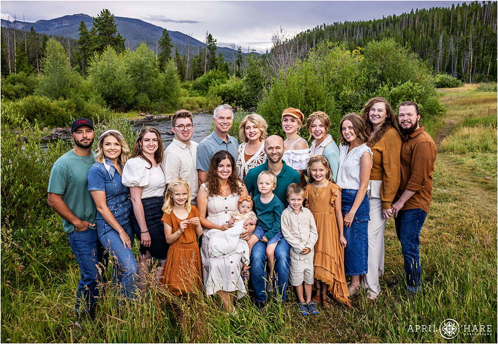 Beautiful river and mountain backdrop for a large family portrait in Grand Lake Colorado