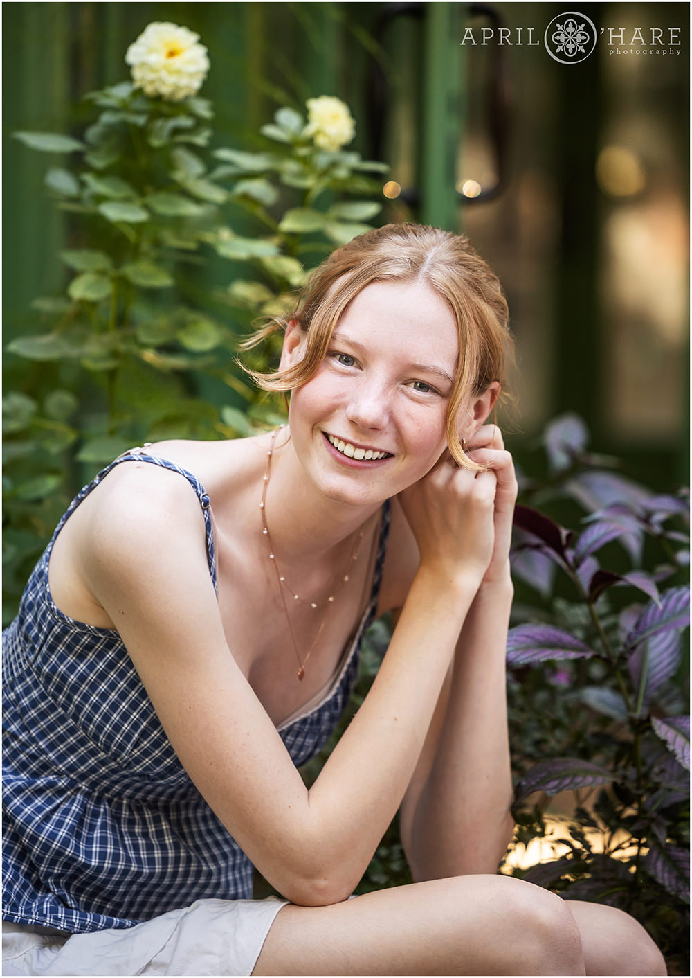 Gorgeous greenhouse garden backdrop for a senior photo at Denver Botanic Gardens