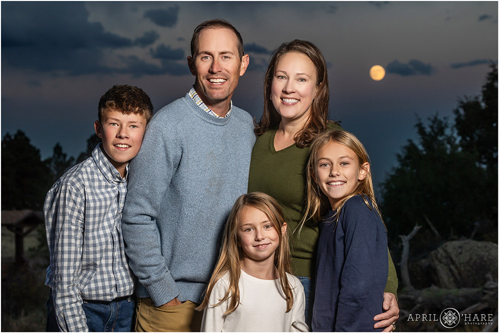 Pretty Full Moon backdrop for a family photo at West Mount Falcon in Colorado