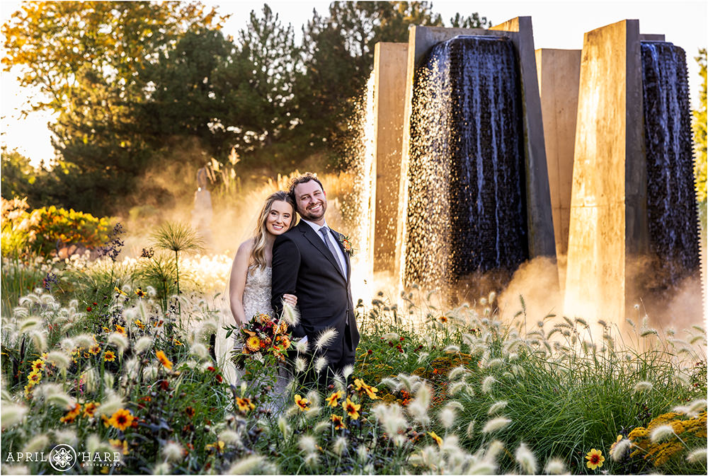 Gorgeous garden backdrop with dramatic concrete fountain for a wedding portrait at Denver Botanic Gardens