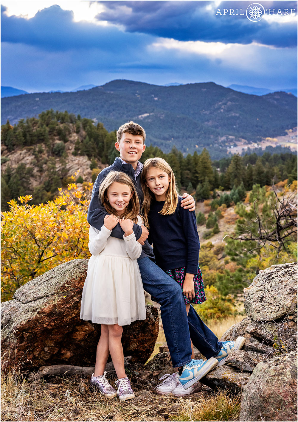 Three siblings at West Mount Falcon trailhead family portrait session in Colorado