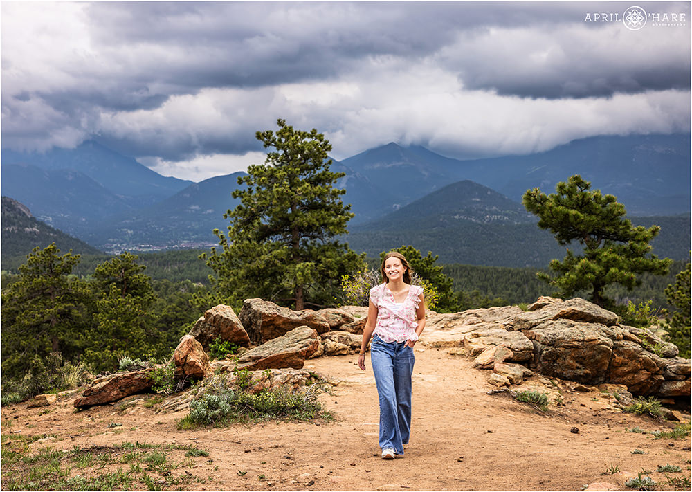Senior photo on a dramatic stormy June evening for her senior session at RMNP