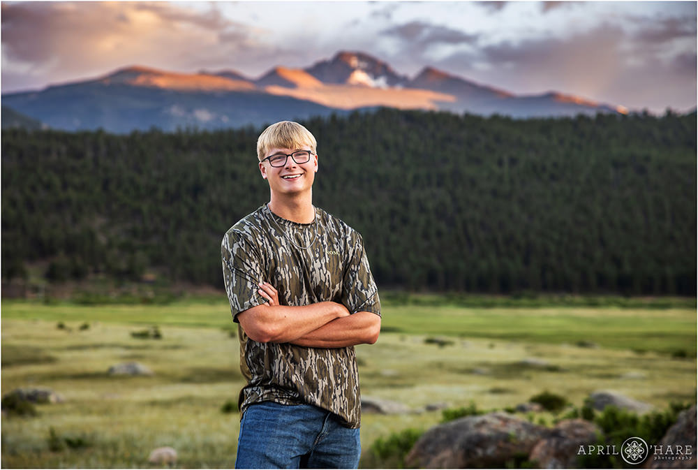 Longs Peak at sunset backdrop for a high school senior photography session in Estes Park