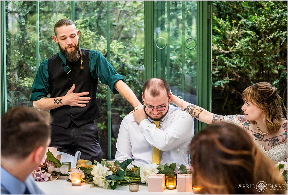 Emotional moment with brothers during a wedding speech at Denver Botanic Gardens Woodland Mosaic
