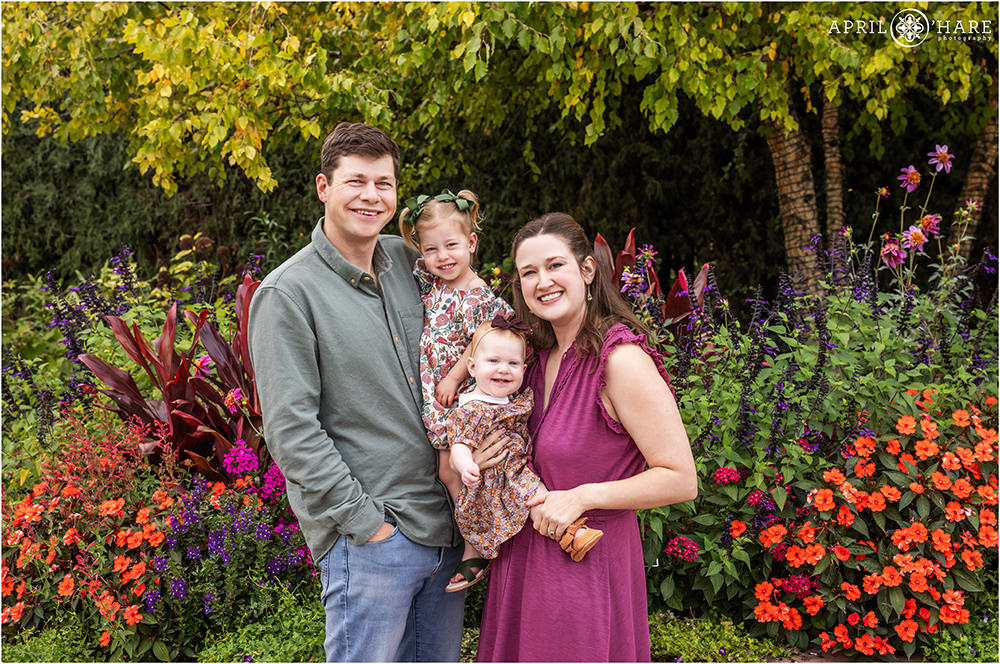 Colorful garden family photography for a family of four with two young girls