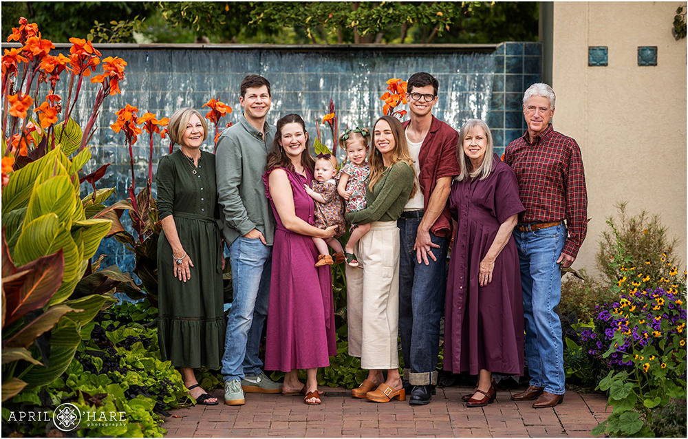 Extended family photo in front of the blue tile waterfall feature at Denver Botanic Gardens