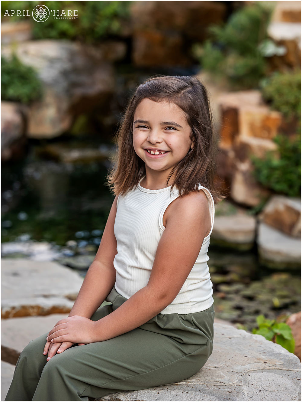 Sweet photo of a young girl at her family photography session at Denver Botanic Gardens