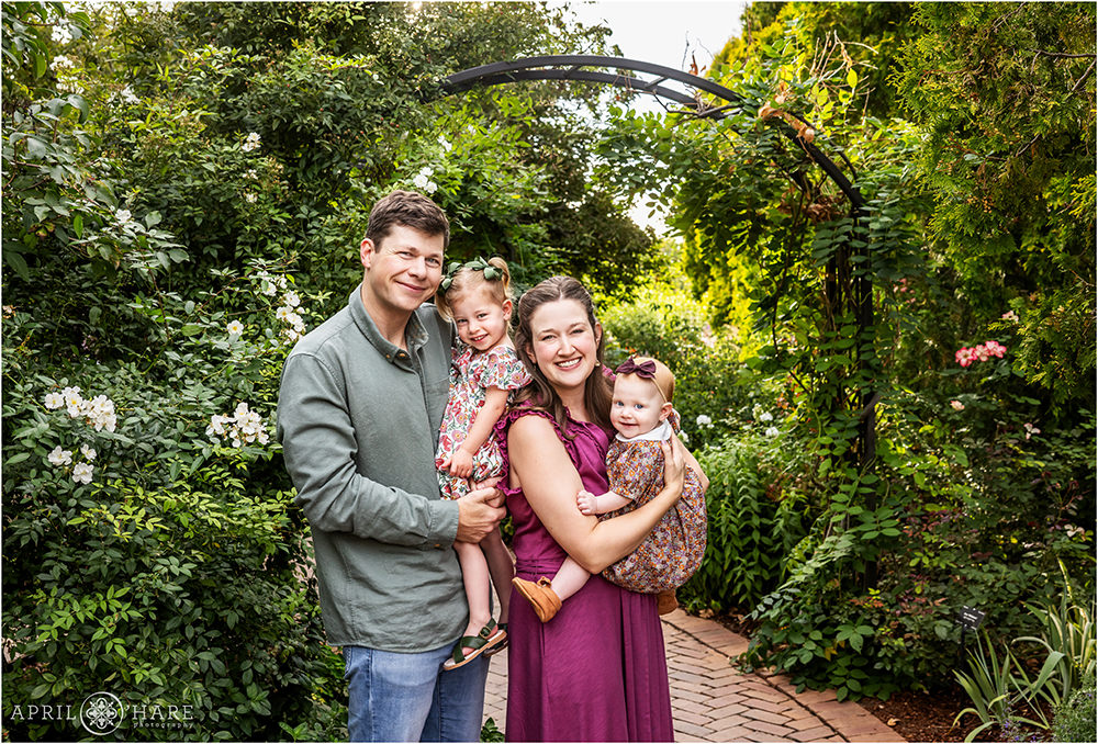 Pretty garden archway backdrop for a family photo at Denver Botanic Gardens