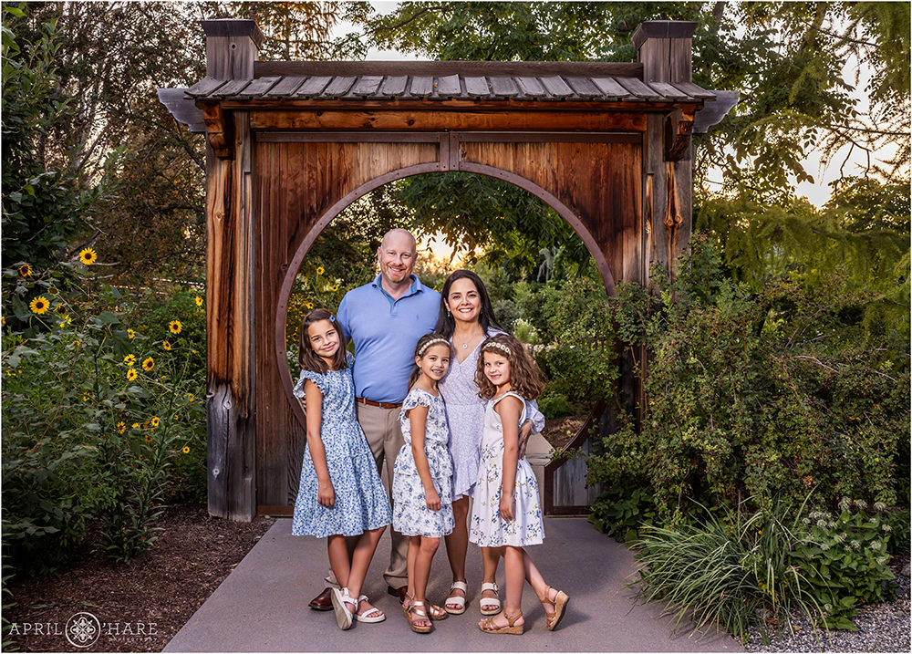 Family photo in front of the pretty Japanese Circle Gate at Denver Botanic Gardens