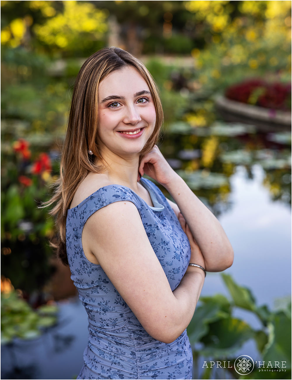 Waterlily pond backdrop for a senior photo at Denver Botanic Gardens