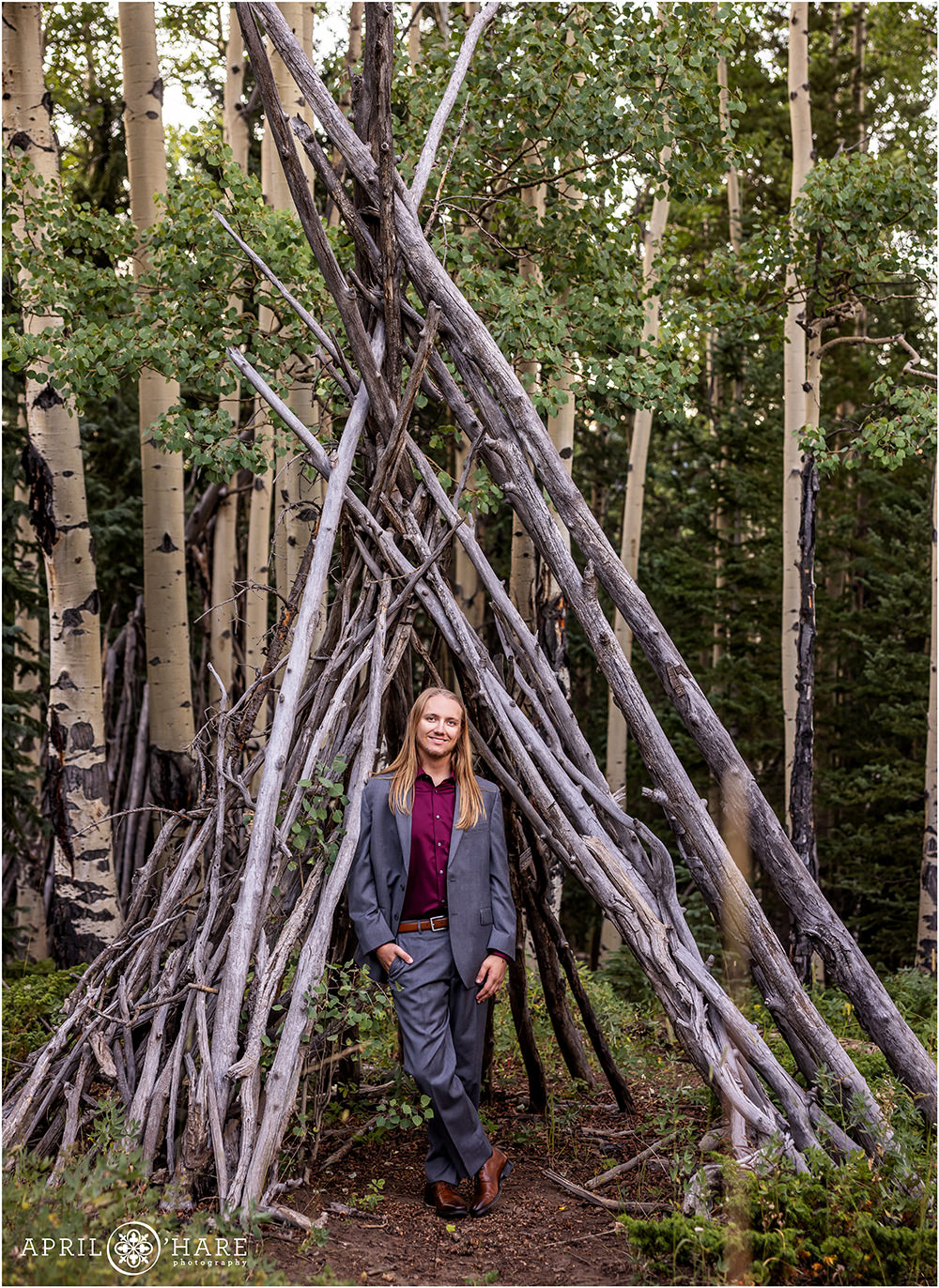 Senior photo in the woods of Evergreen Colorado