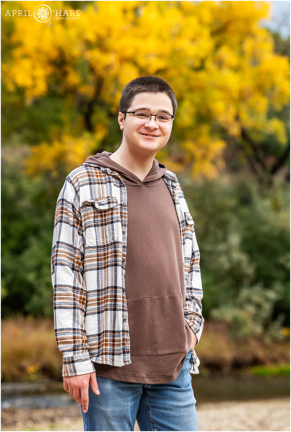 Wheat Ridge Colorado Clear Creek Fall Color Family Photography session individual portrait of oldest son by himself