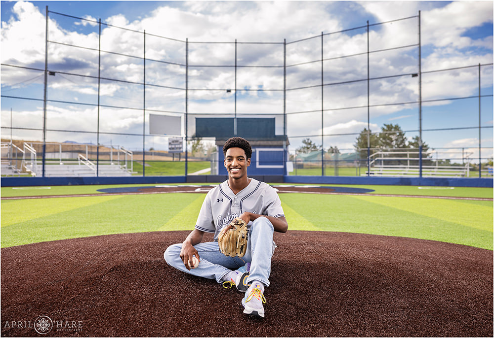 High school senior baseball photo on the newly redone field at Columbine High School in Littleton CO