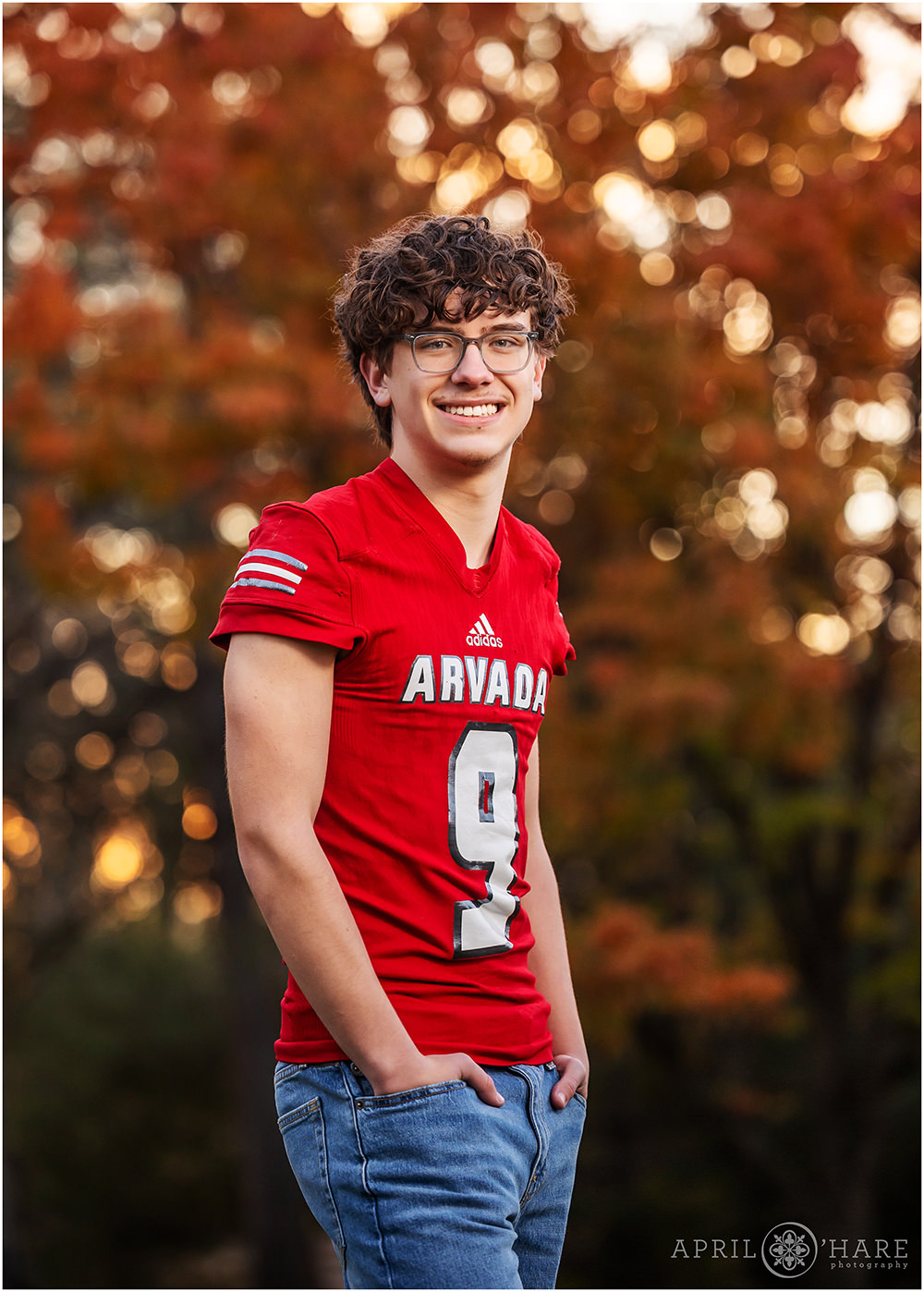 Autumn color backdrop for a high school senior photo in Wheat Ridge Colorado