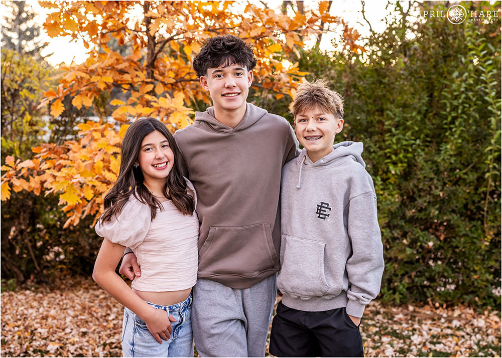 Three siblings in the fall color at home in Littleton Colorado