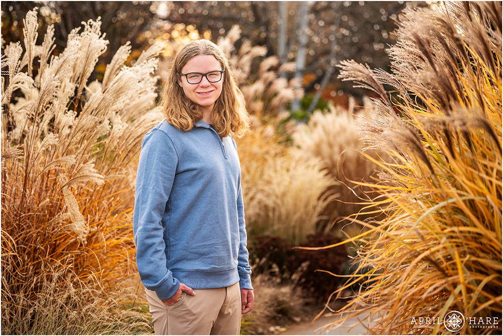 High school senior with pretty feather grass backdrop at Denver Botanic Gardens
