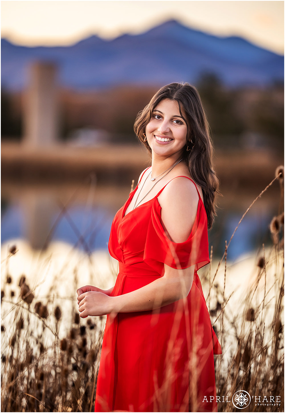 Mountain Backdrop with a lake for senior photo at home in Colorado