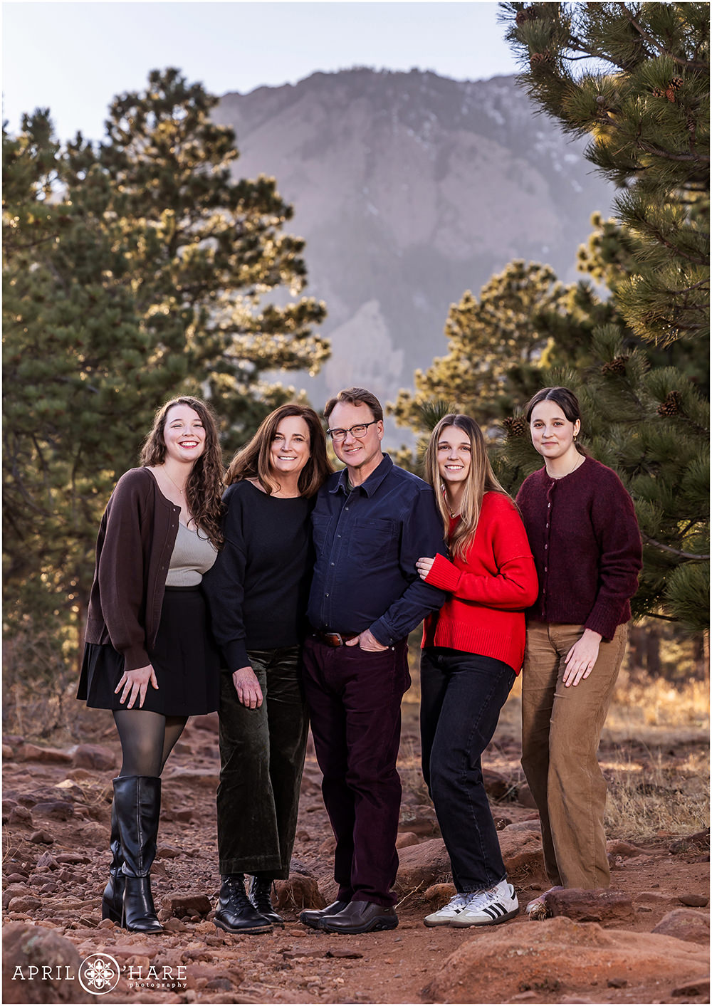 Family portrait with a mountain backdrop in Boulder Colorado on a warm December day