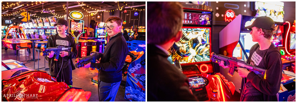 Two friends play video games together at a bar mitzvah party at Super Awesome Fun Factory in Denver CO