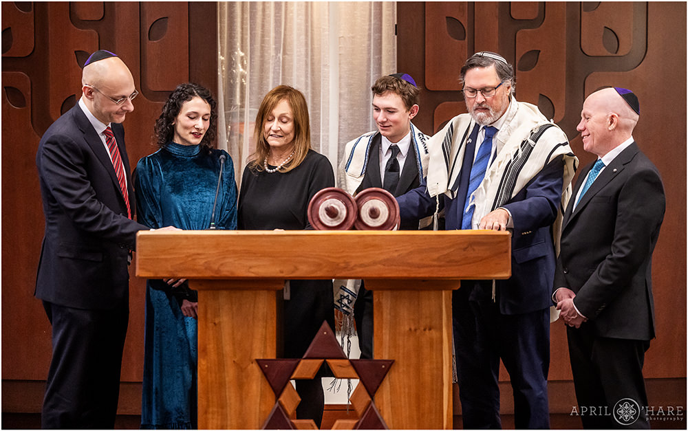 Family on the Bimah together at bar mitzvah rehearsal at Temple Sinai in Denver CO