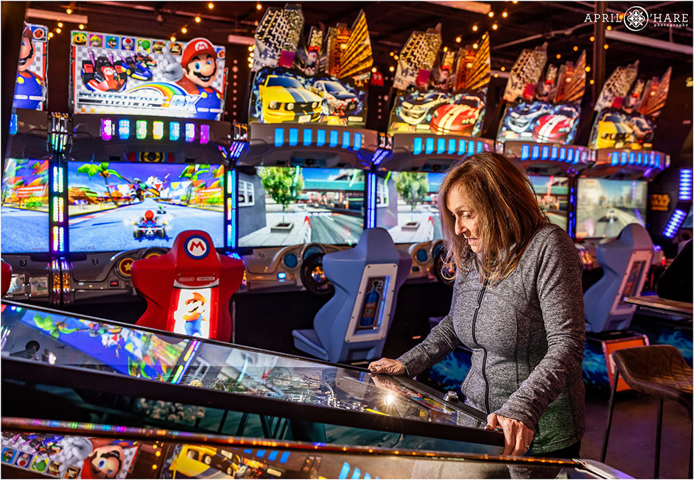 Playing pinball at Super Awesome Fun Factory in Denver CO